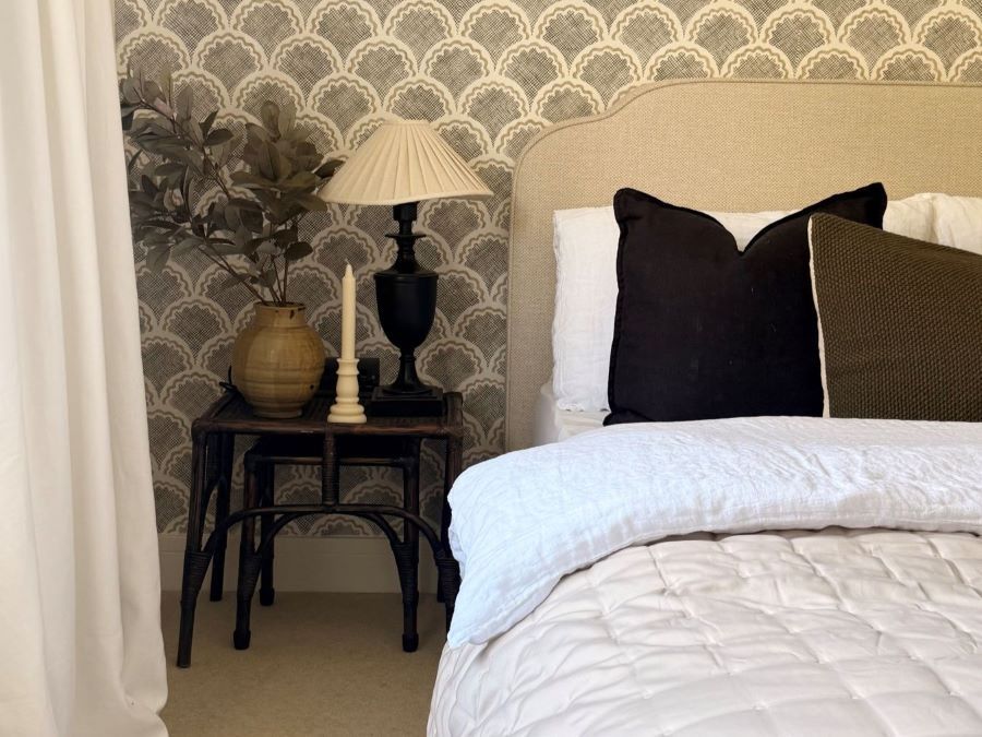 neutral carpet and bed with elegant wallpaper